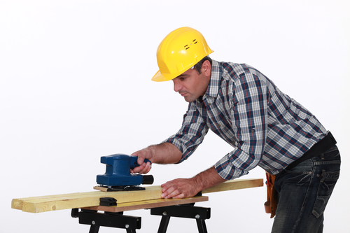 Workman Using A Power Tool
